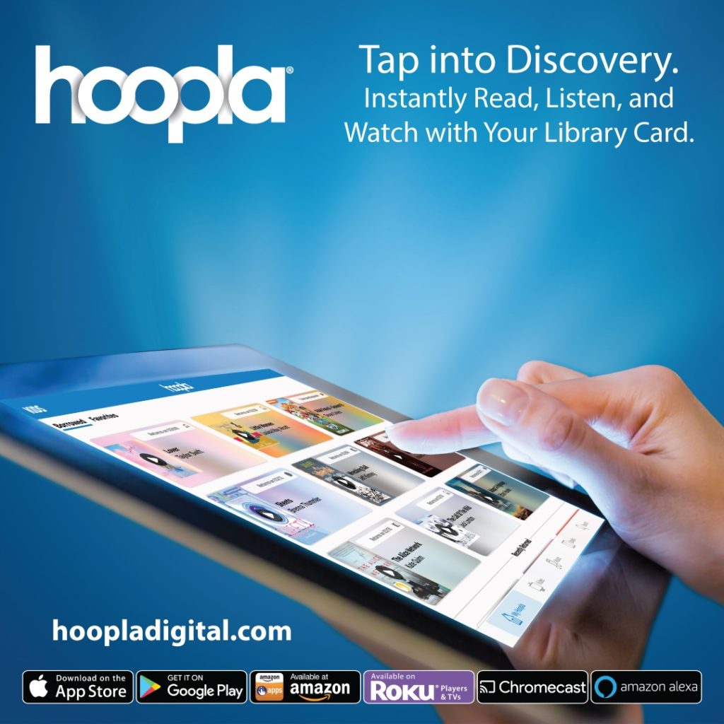 A hand navigates a tablet with the hoopla app.